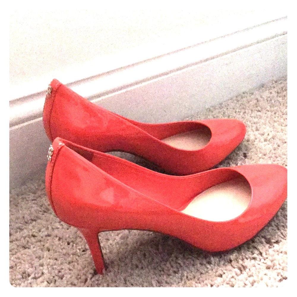 COACH patent leather pumps.
